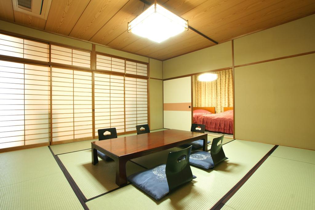 Imakuni Ryokan Такатихо Номер фото